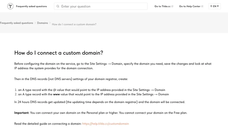 Tilda FAQ answer on connecting a custom domain with two A records and a Personal plan requirement